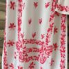 Close-up of the Beautiful White Chikankari Set in Shaded Pink highlighting intricate handcrafted pink Chikankari embroidery on premium modal fabric.