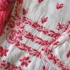 Intricate handcrafted pink Chikankari embroidery on the Beautiful White Chikankari Set in Shaded Pink crafted in premium modal fabric.