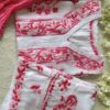 Folded Beautiful White Chikankari Set in Shaded Pink with handcrafted pink Chikankari embroidered kurta, layered modal palazzo, and pink cotton Chuna dupatta.