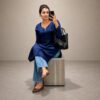 Woman wearing a Gorgeous Navy Blue Chikankari Kurti with Denims featuring elegant Lucknowi Chikankari work.