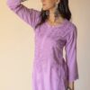 Lavender chikankari kurti with denims showing side view