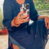 Mesmerizing Mukaish Chikankari Kurti with Denims in sitting pose, full view