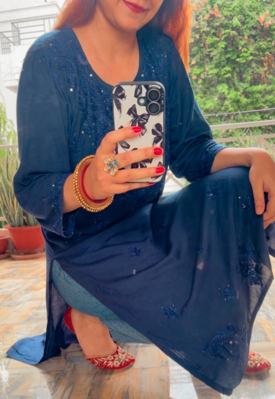 Mesmerizing Mukaish Chikankari Kurti with Denims 1 Mesmerizing Mukaish Chikankari Kurti with Denims in sitting pose, full view