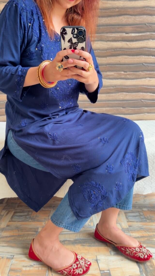 Mesmerizing Mukaish Chikankari Kurti with Denims 3 Mesmerizing Mukaish Chikankari Kurti with Denims styled in a sitting side pose