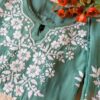 Pastel Sea Green Muslin Chikankari Kurta Set 4 Close-up of the folded pastel sea green muslin chikankari kurta set showcasing intricate chikankari embroidery.
