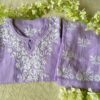 Radiant Lilac Lavender Muslin Chikankari Kurta Set folded display showcasing elegant embroidery and premium muslin fabric.