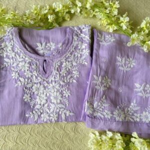Home-Ada Boutique 2 Radiant Lilac Lavender Muslin Chikankari Kurta Set folded display showcasing elegant embroidery and premium muslin fabric.
