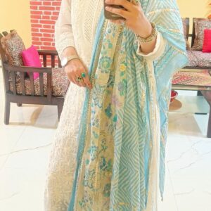 Front view of white chikankari kurti set with pant and dupatta